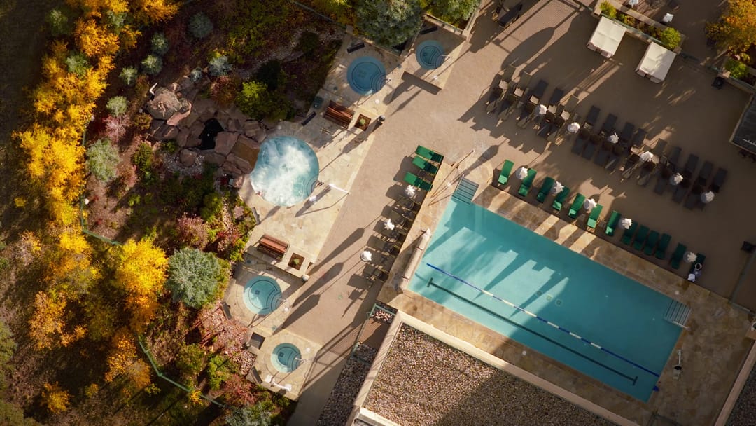 Pool and hot tubs from directly above, aspens in fall color, Park Hyatt Beaver Creek