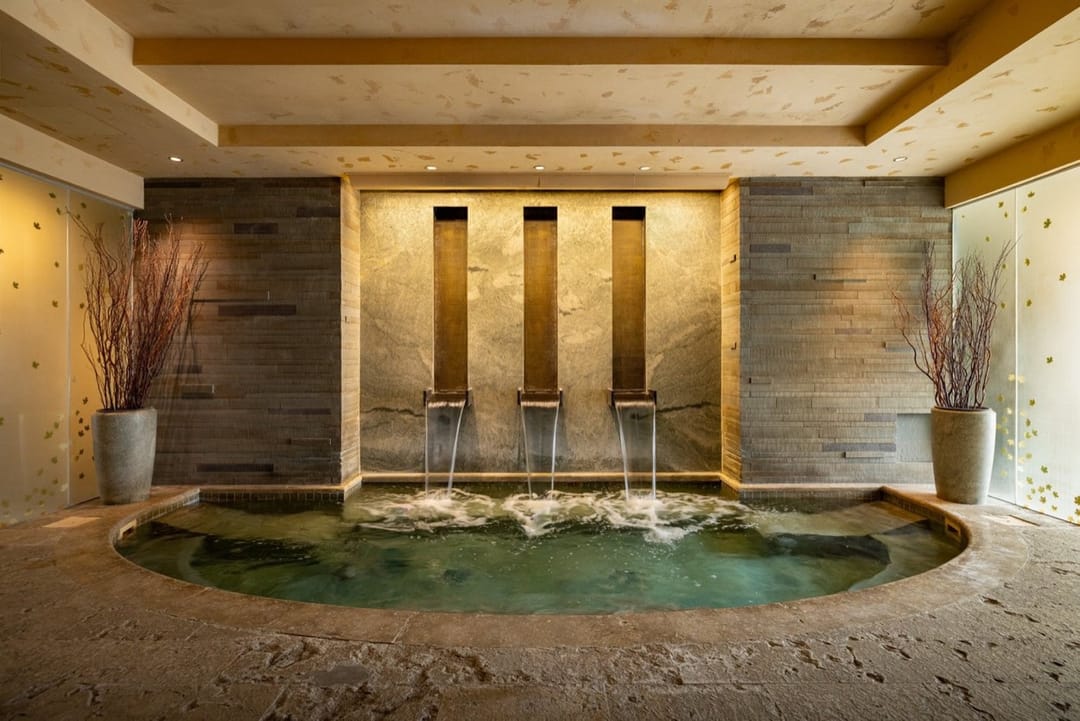 Spa pool under three stone water spouts, Park Hyatt Beaver Creek